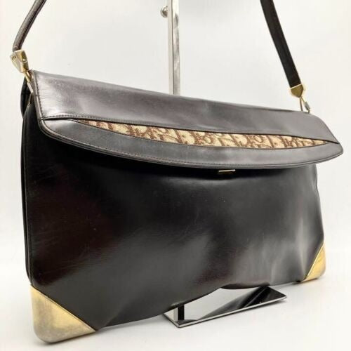 RARE, vintage, Dior, brown leather two-wy clutch/shoulder bag with a brown trotter print interior and accent that peeks through the front