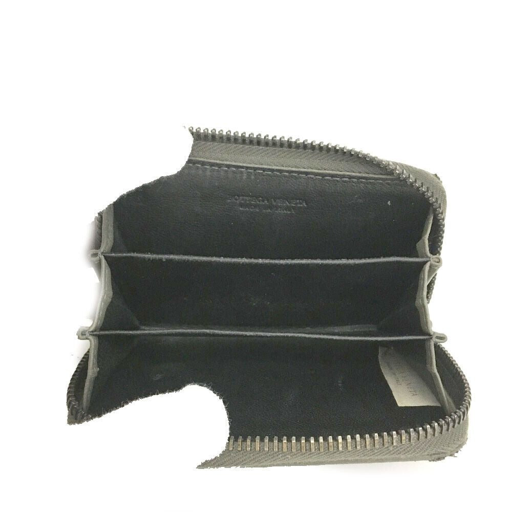Bottega Veneta, grey intrecciato leather wallet with three compartments and a zip around style!