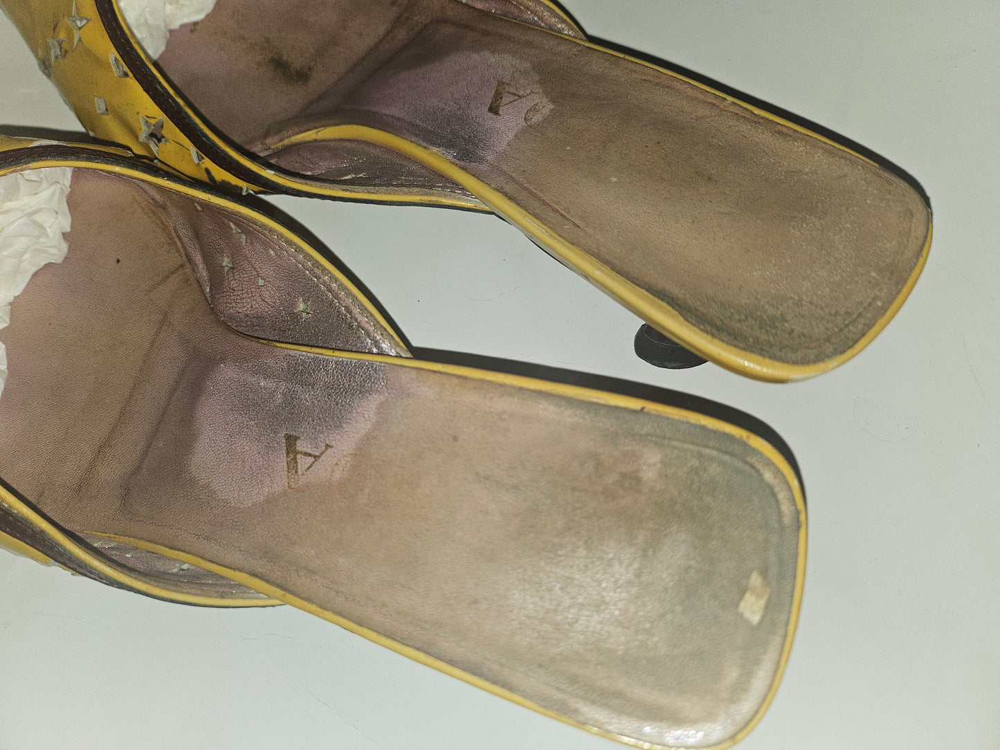 Prada kitten heel mules in yellow, brown, & dark red with star cut outs