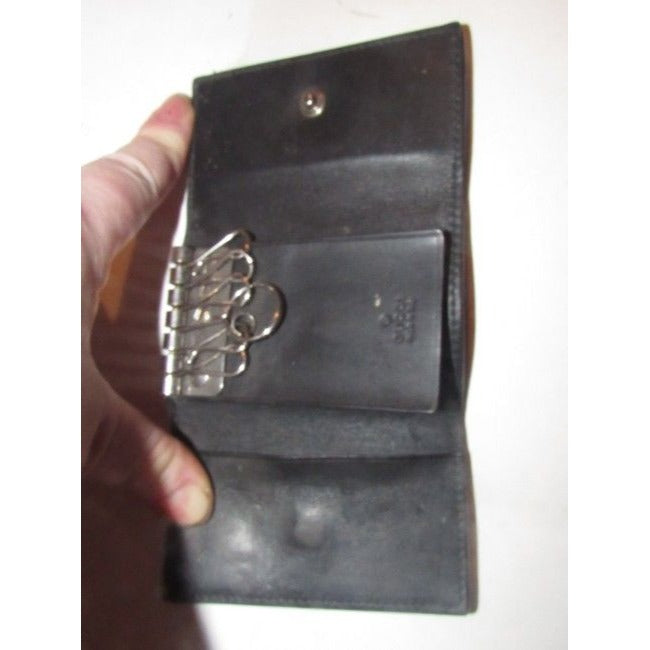 Gucci, black leather, snap close, tri-fold, key holder/card holder, mini- wallet w chrome accents & slots for your cards & six key holders