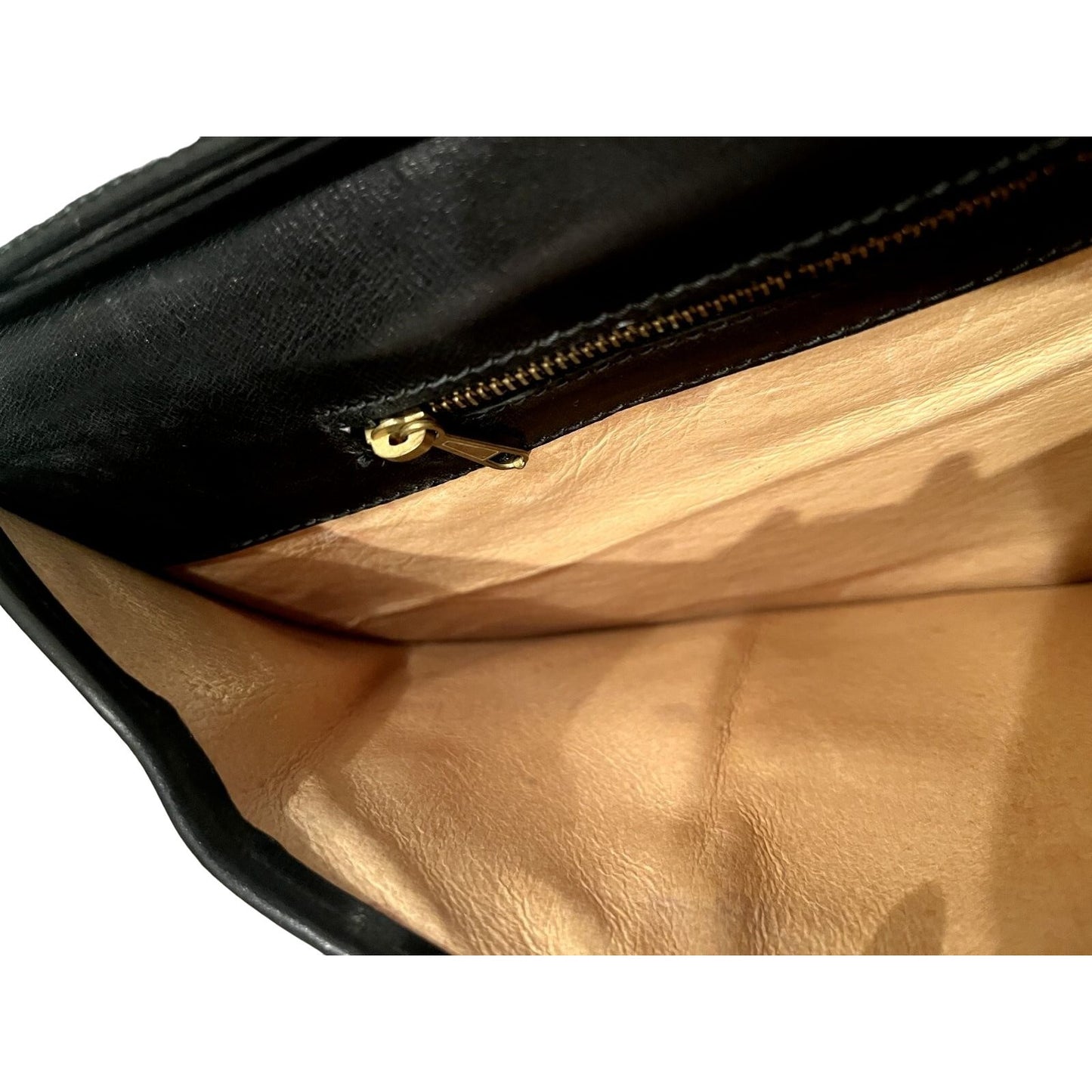 Vintage, rare, black leather, Gucci shoulder bag with a large, two-tone 'GG' emblem and removable strap