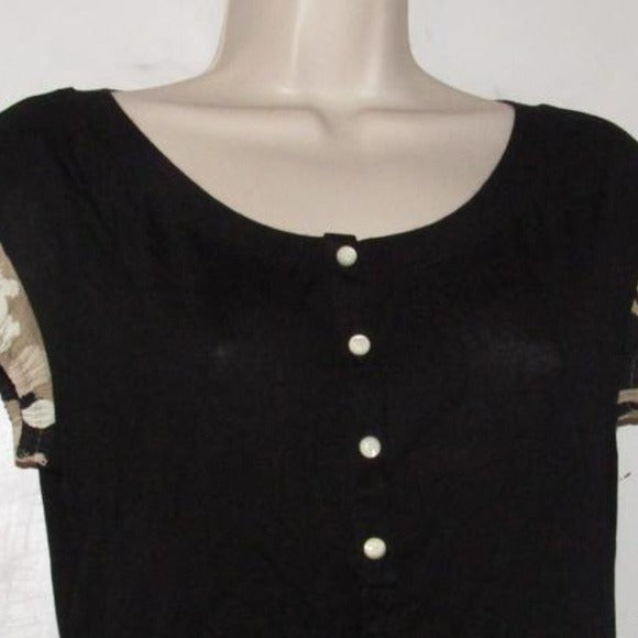 Moschino, size 10, black, 100% rayon knit top with a scoop neck, four button front placket, pearly buttons, and red, brown, white, black abstract floral print cap sleeves