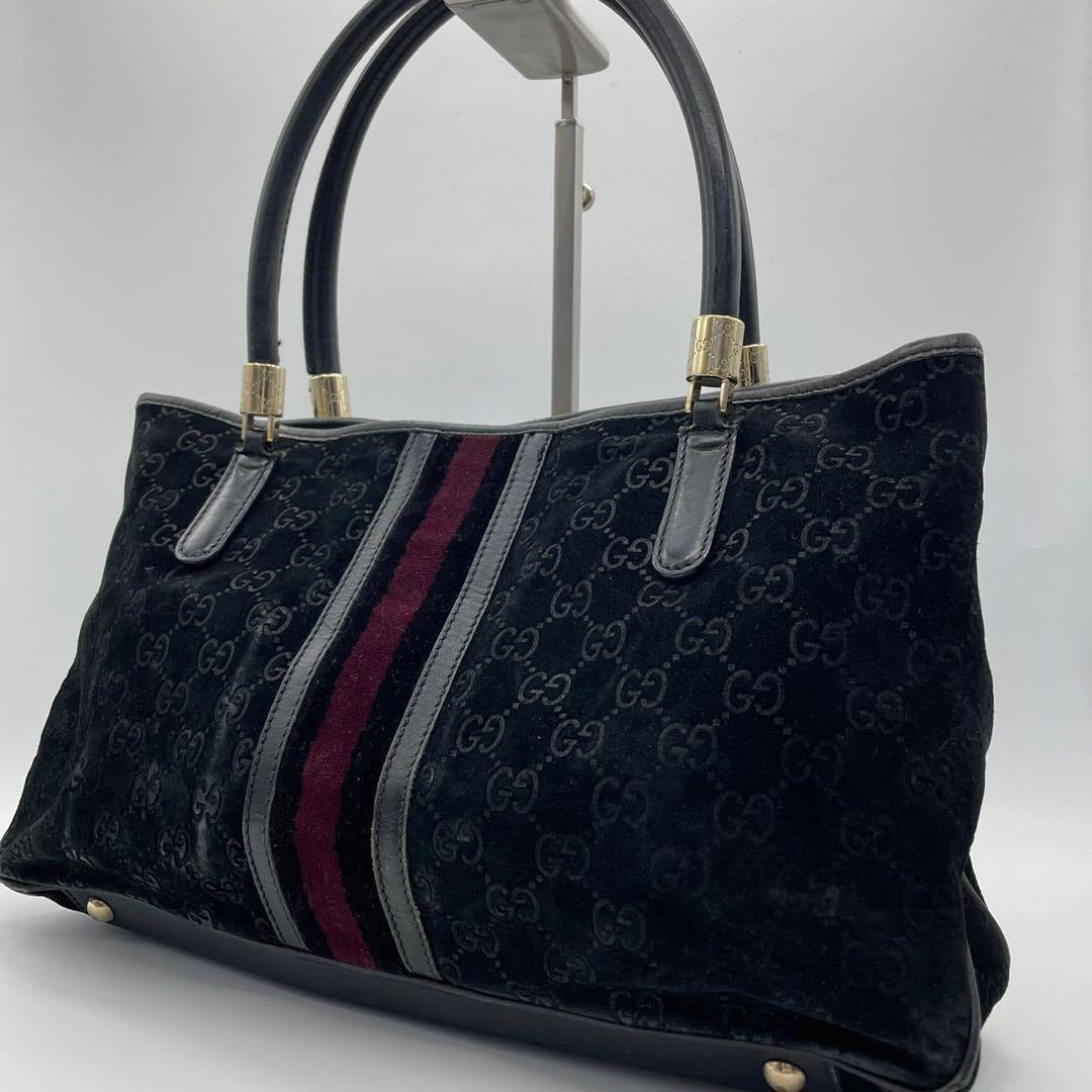 Gucci metallic G on black suede satchel w red & blue stripe