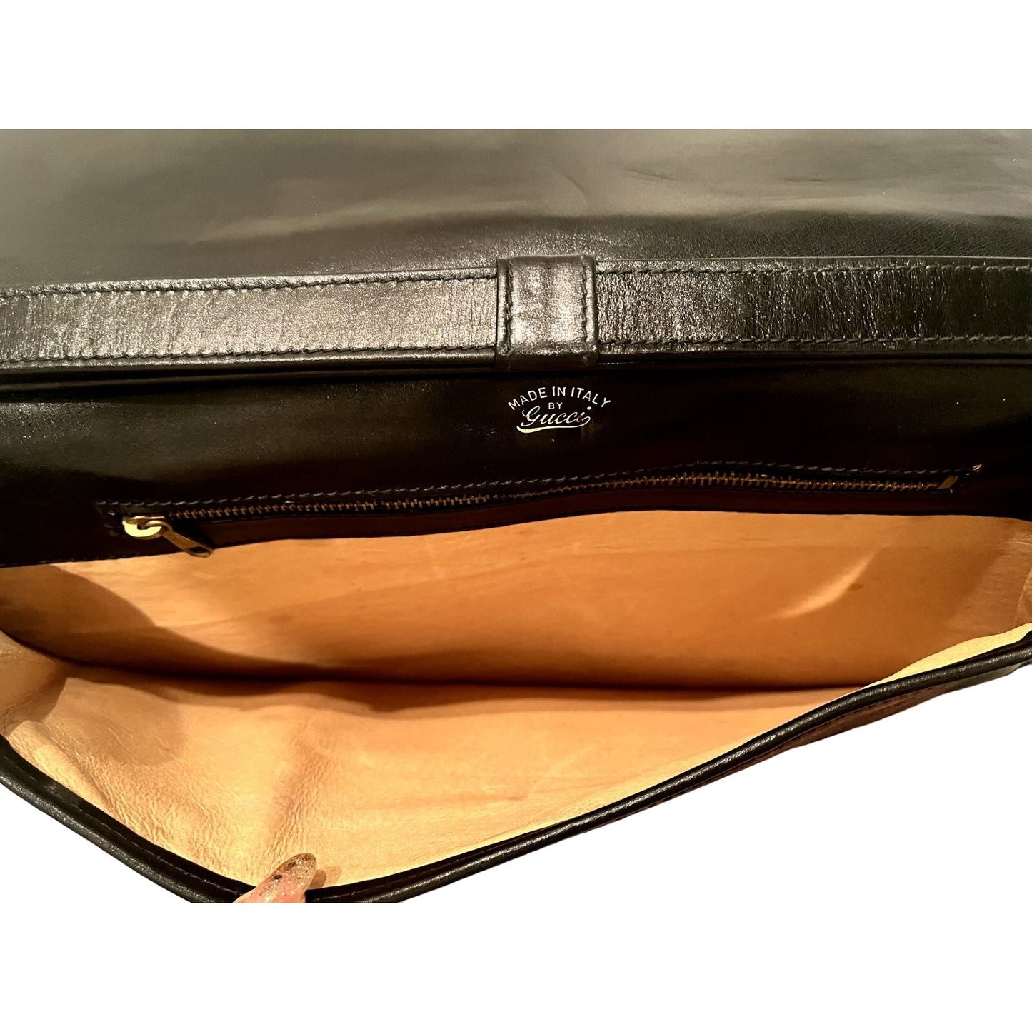 Vintage, rare, black leather, Gucci shoulder bag with a large, two-tone 'GG' emblem and removable strap