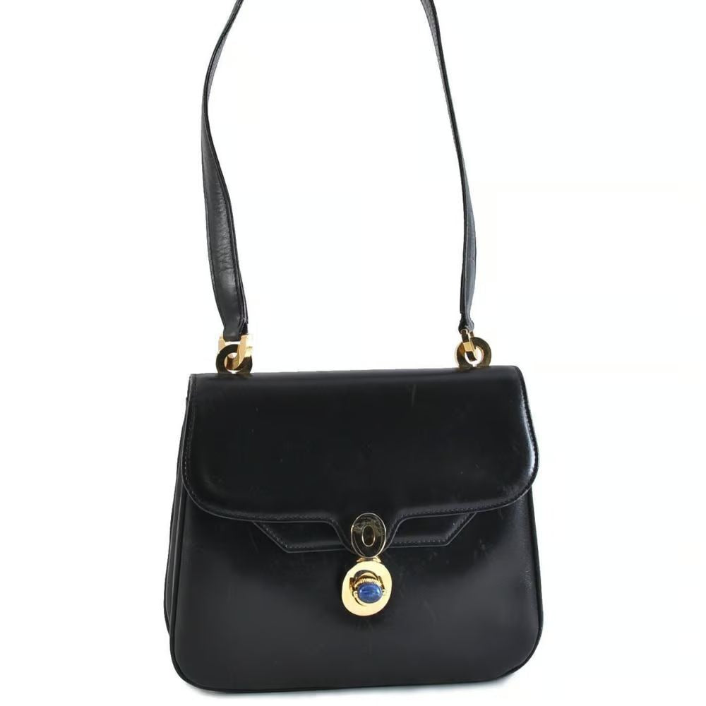 Unique 1960s Gucci mod, black leather, shoulder bag with a beautiful, blue, lapis lazuli accent on the clasp & bold gold hardware