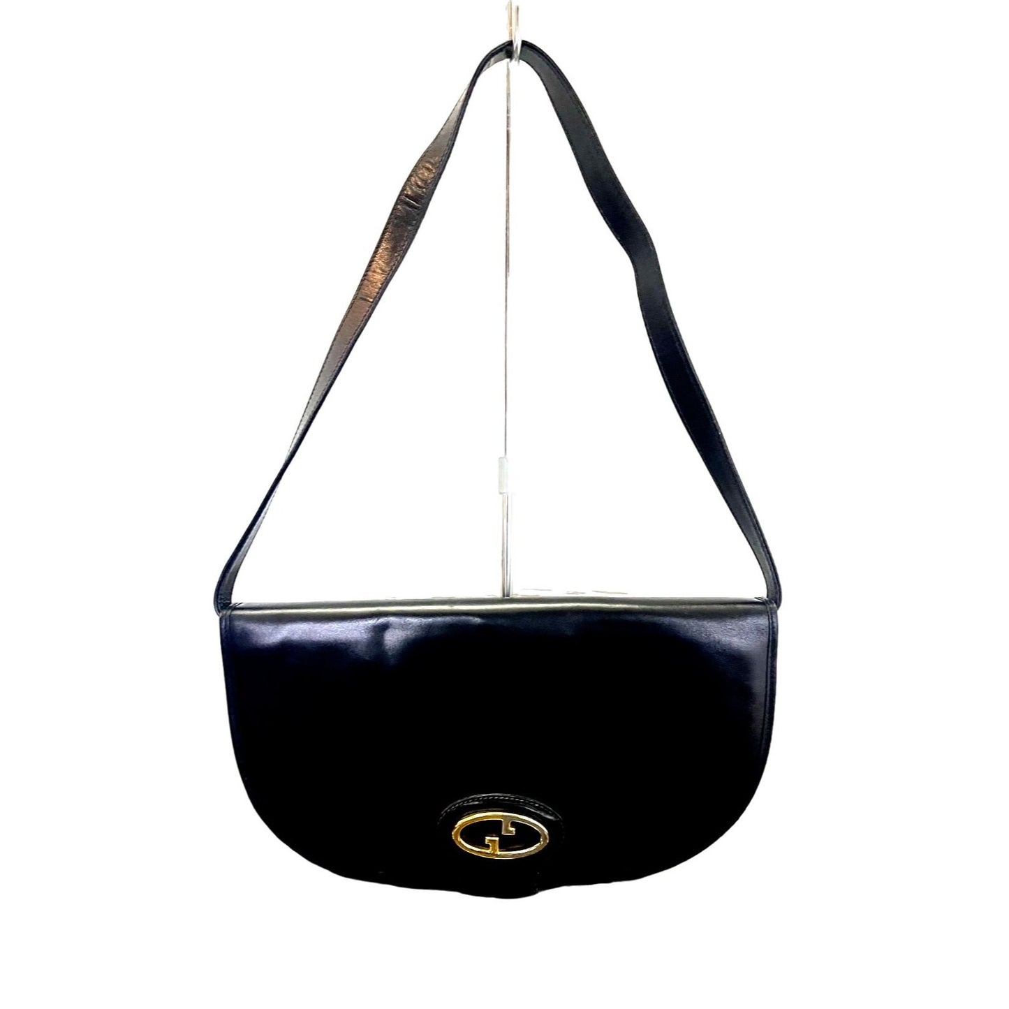 Vintage, rare, black leather, Gucci shoulder bag with a large, two-tone 'GG' emblem and removable strap