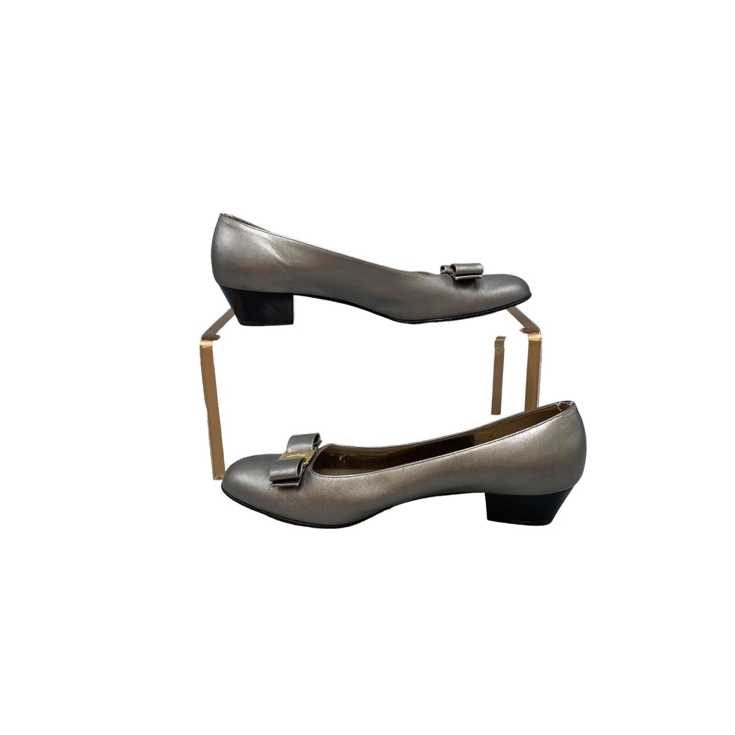 Ferragamo silver leather, 1 inch wood stacked heel, slip-on Vara flats with a 3 inch wide, embellished bow at toe with gold tone hardware