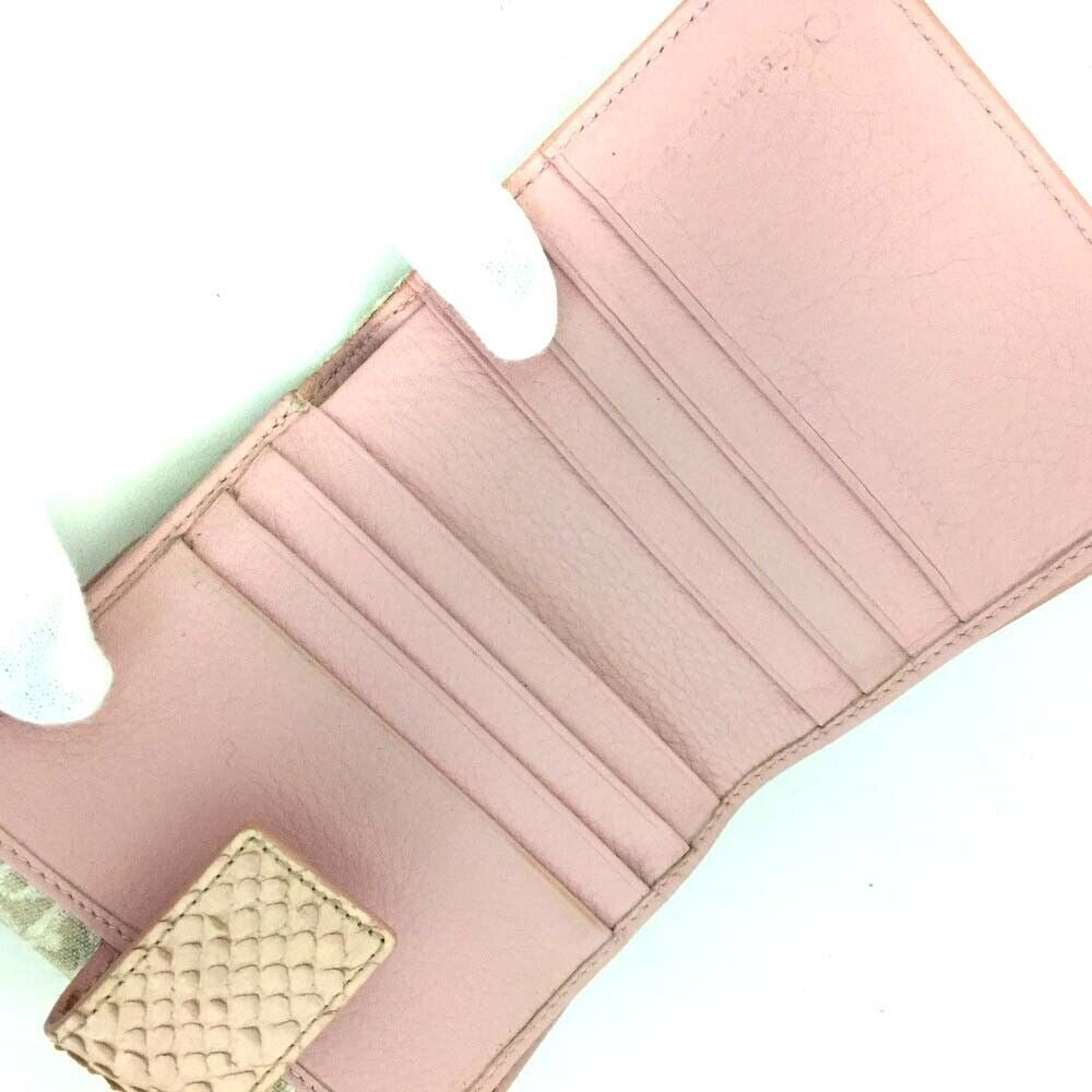 RARE, Christian Dior, pink lizard & tan canvas wallet w a white Diorissimo trotter print, a chrome 'Dior' plaque, & lots of slots for cards