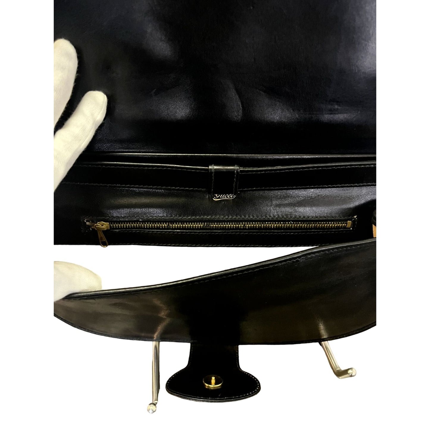 Vintage, rare, black leather, Gucci shoulder bag with a large, two-tone 'GG' emblem and removable strap