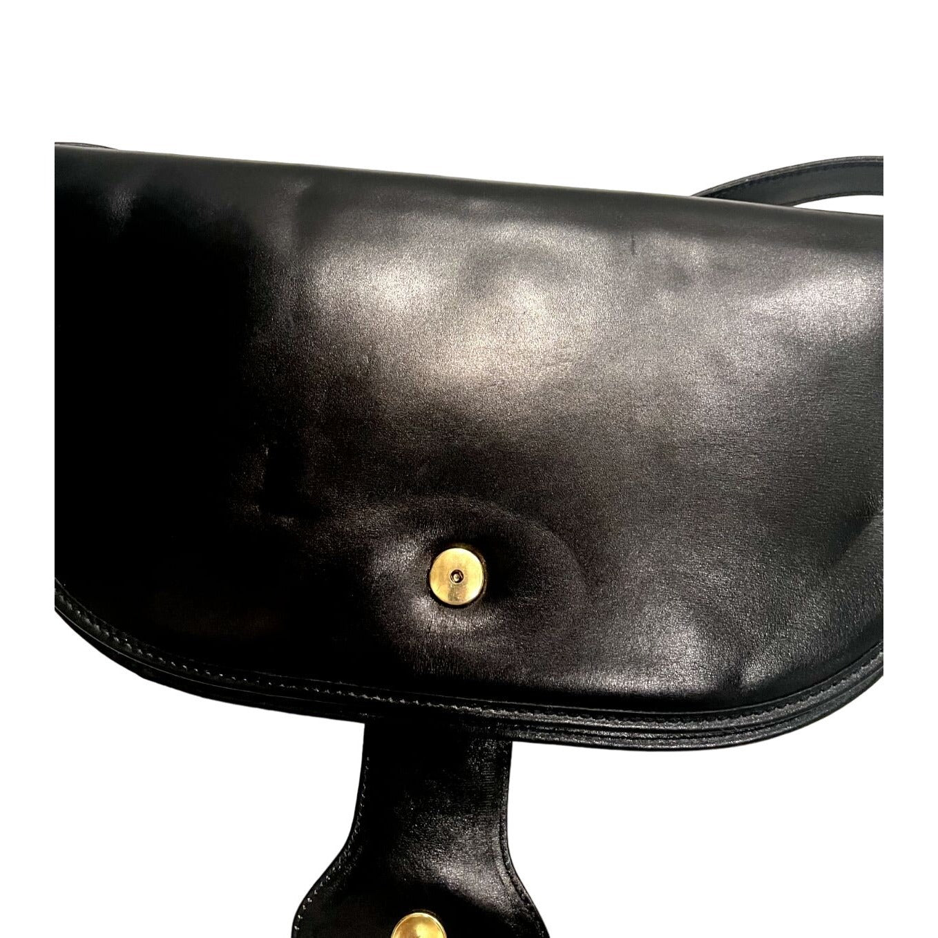 Vintage, rare, black leather, Gucci shoulder bag with a large, two-tone 'GG' emblem and removable strap