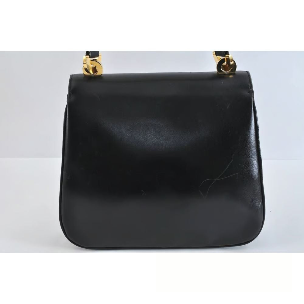 Unique 1960s Gucci mod, black leather, shoulder bag with a beautiful, blue, lapis lazuli accent on the clasp & bold gold hardware