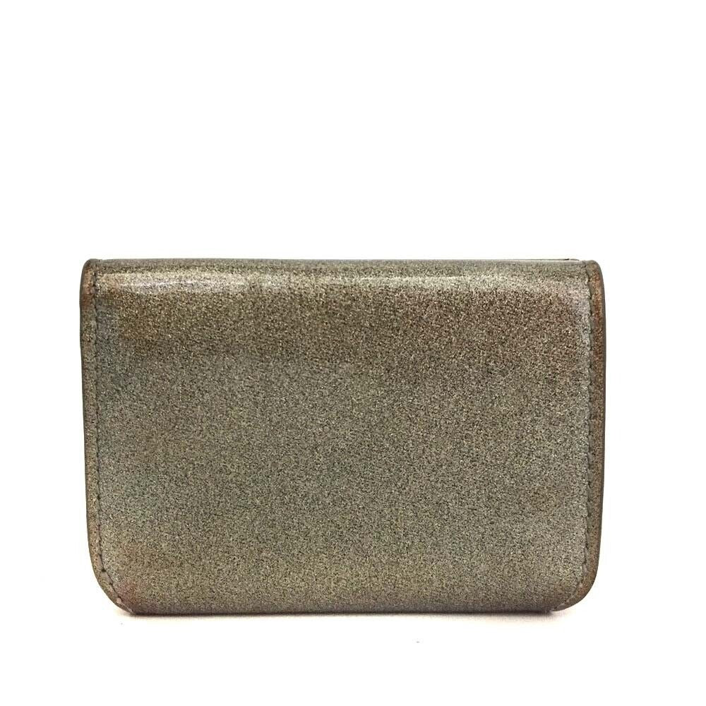 Balenciaga, gold leather wallet with two compartments and a snap close change purse & tri-fold wallet