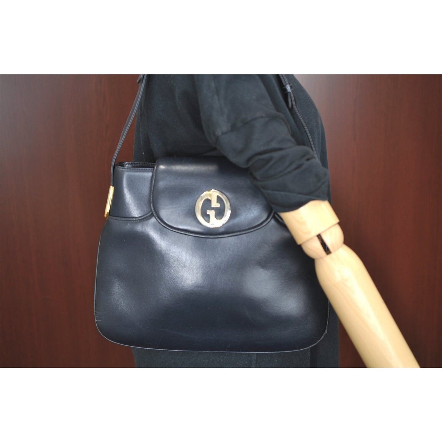 Gucci 1973 navy leather roomy handbag with a gold GG snap
