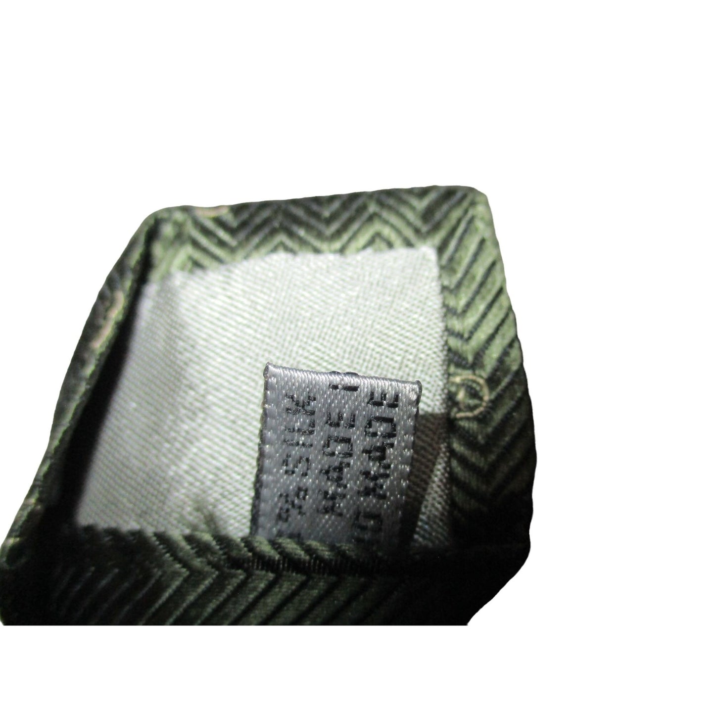 Vintage Christian Dior tie made of 100% textured, olive green silk with a logo print in shades of tan