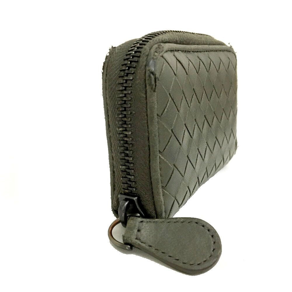 Bottega Veneta, grey intrecciato leather wallet with three compartments and a zip around style!