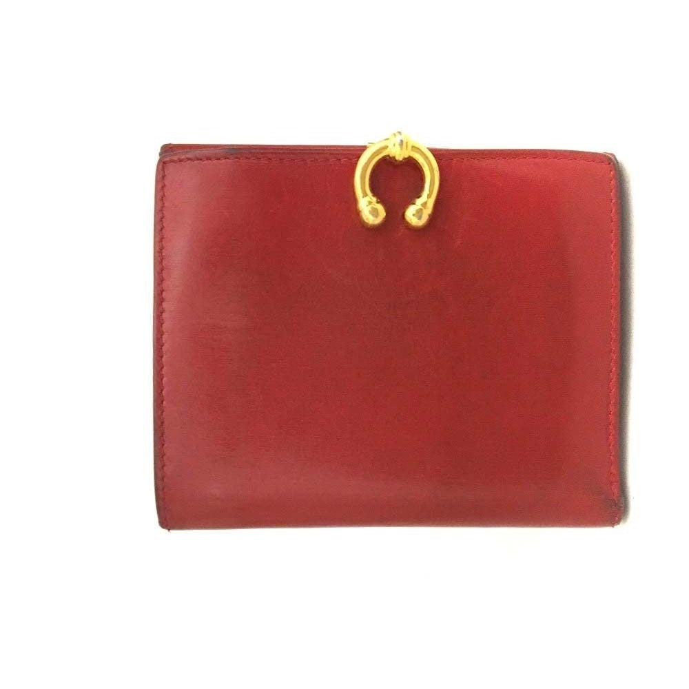 Gucci, red leather, bi-fold style, wallet with multiple pockets, tons of card slots, & a gold, engraved 'GUCCI' horseshoe accent