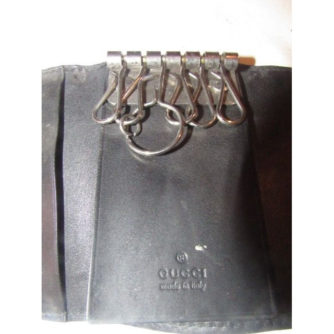 Gucci, black leather, snap close, tri-fold, key holder/card holder, mini- wallet w chrome accents & slots for your cards & six key holders