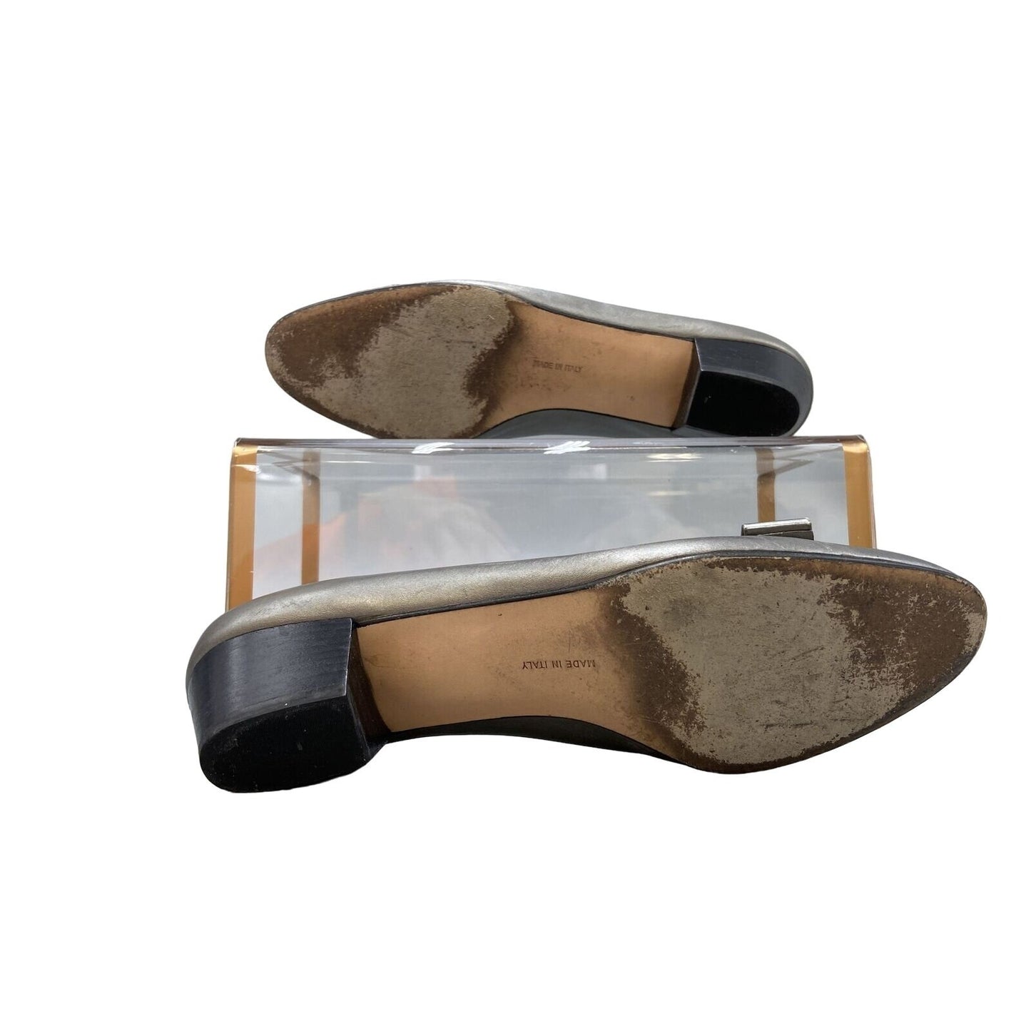 Ferragamo silver leather, 1 inch wood stacked heel, slip-on Vara flats with a 3 inch wide, embellished bow at toe with gold tone hardware