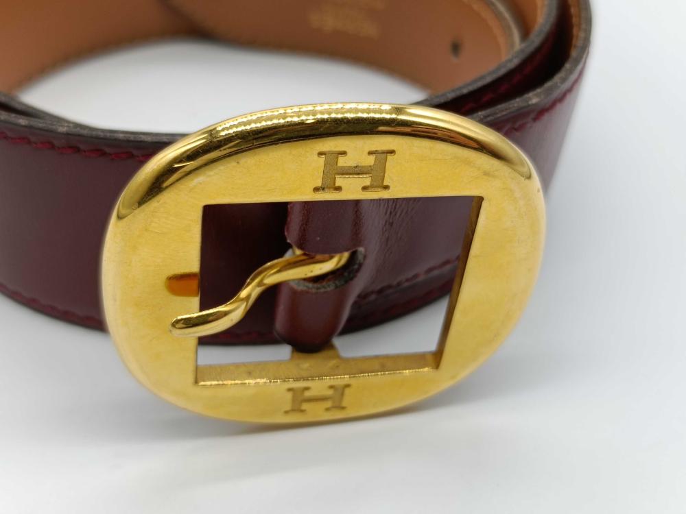 Hermes burgundy leather bet with gold engraved buckle