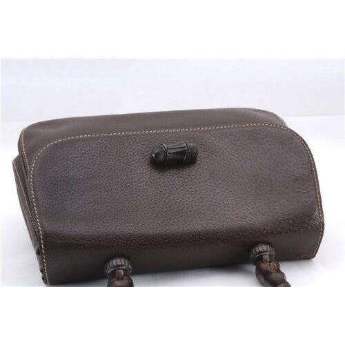 Vintage Gucci boarskin leather top handle Kelly style purse with bamboo look accents and carved wood handle