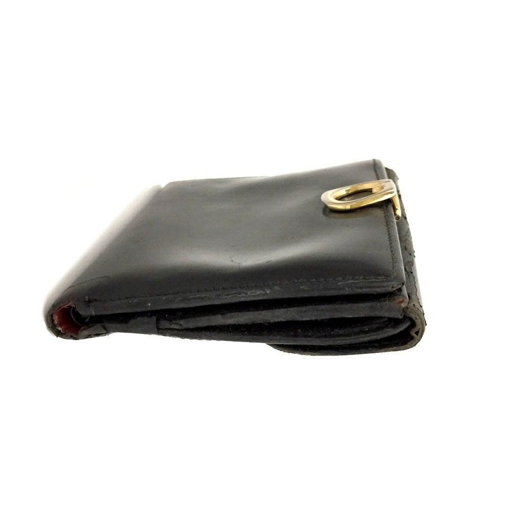 Gucci, blsck glossy leather, bi-fold style, rectangular, wallet with multiple pockets, tons of card slots, and a gold, hinged G clasp