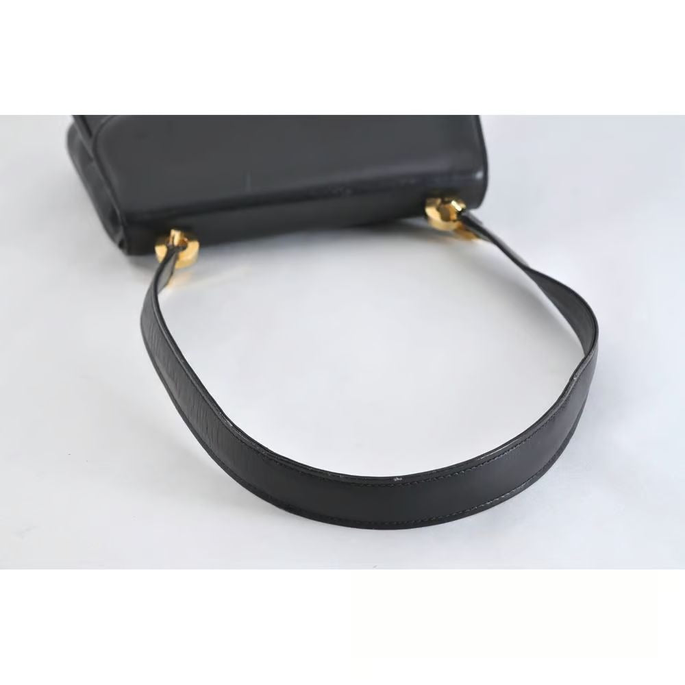 Unique 1960s Gucci mod, black leather, shoulder bag with a beautiful, blue, lapis lazuli accent on the clasp & bold gold hardware