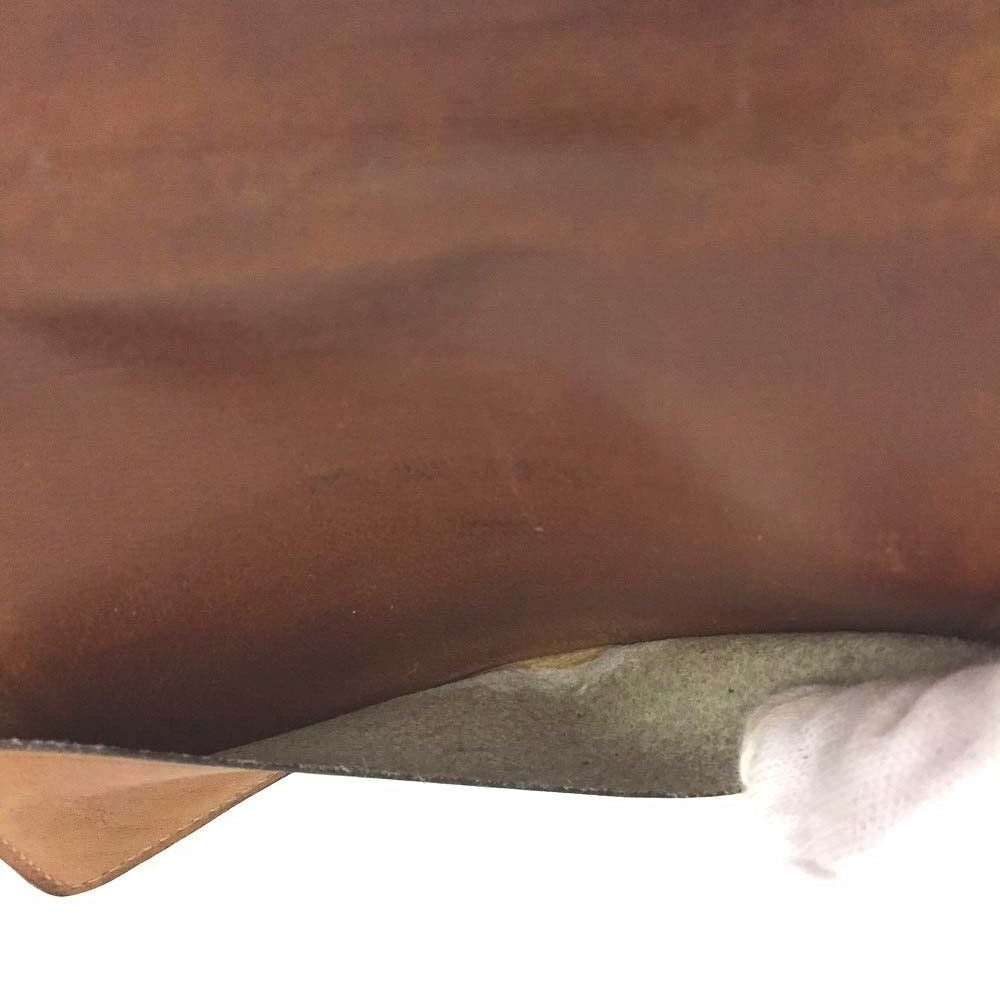 Early Gucci brown canvas with an orange diagonal GG logo print and camel leather bi-fold wallet