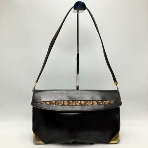 RARE, vintage, Dior, brown leather two-wy clutch/shoulder bag with a brown trotter print interior and accent that peeks through the front