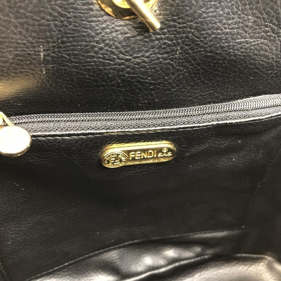 Fendi, black quilted suede with a 'pasta' or 'noodle' design, two way, sling style- clutch or cross body bag with gold 'pasta' accent beads