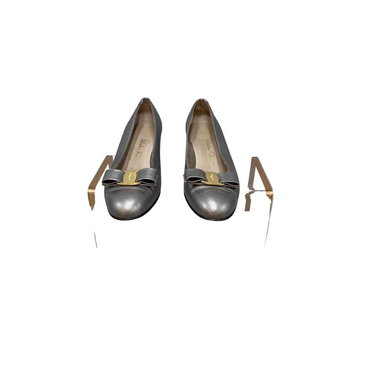 Ferragamo silver leather, 1 inch wood stacked heel, slip-on Vara flats with a 3 inch wide, embellished bow at toe with gold tone hardware