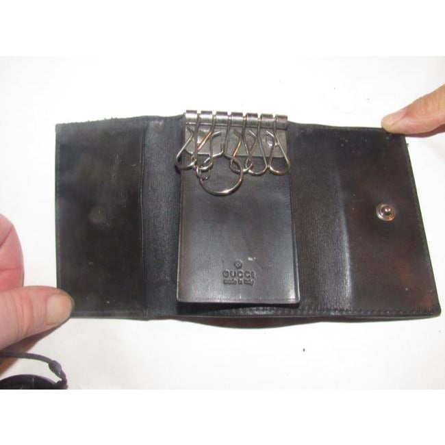Gucci, black leather, snap close, tri-fold, key holder/card holder, mini- wallet w chrome accents & slots for your cards & six key holders