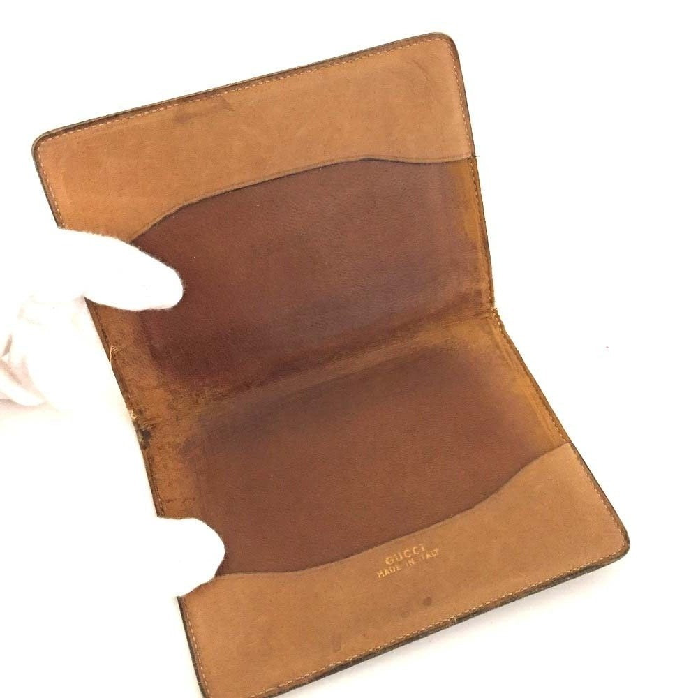Early Gucci brown canvas with an orange diagonal GG logo print and camel leather bi-fold wallet