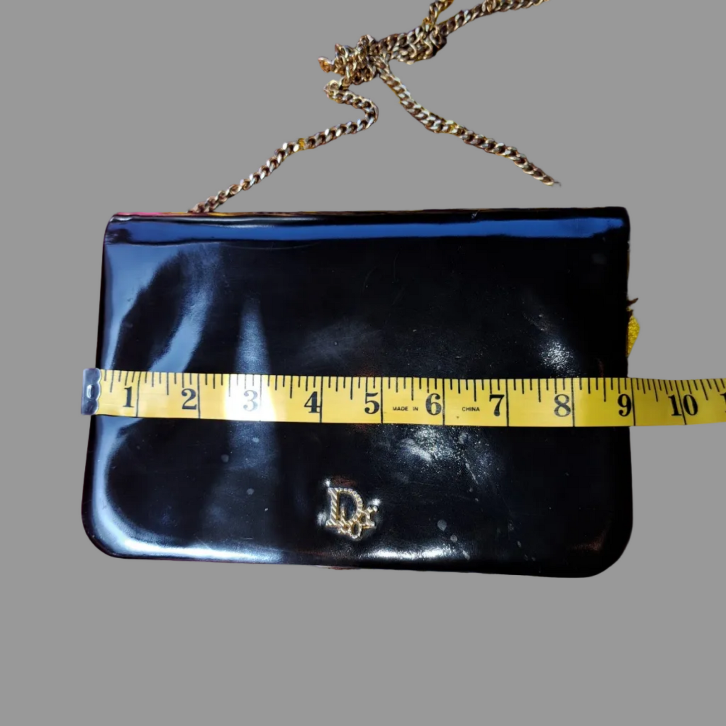 Dior shiny black leather two way envelope purse with a gold chain strap