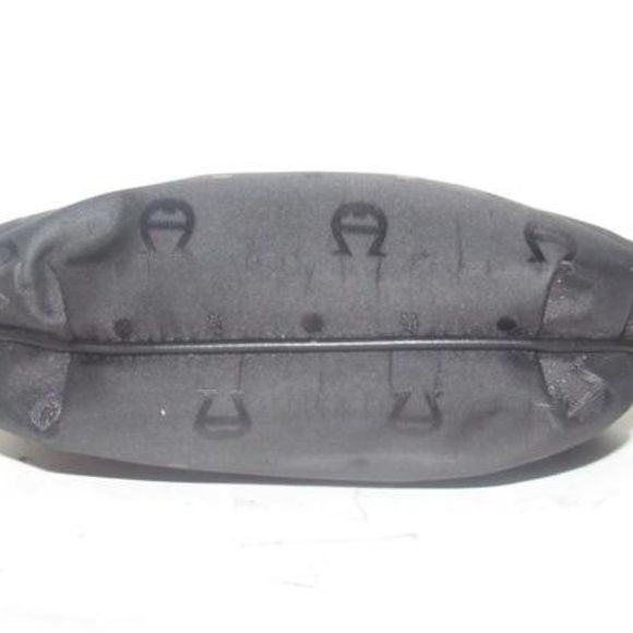 Etienne Aigner black logo design nylon and black leather, clutch or cosmetic bag with gold tone logo accents, a hinged opening