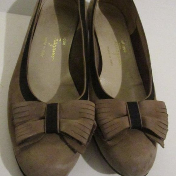 Salvatore Ferragamo VARA brown suede flats with black trim, large, fringe bows at the toes, and low, wedge heels
