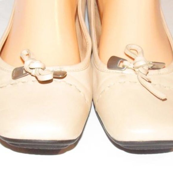 Prada Pink Beige Leather Ballet Flats with an Almond Toe and Bow with Chrome Accents