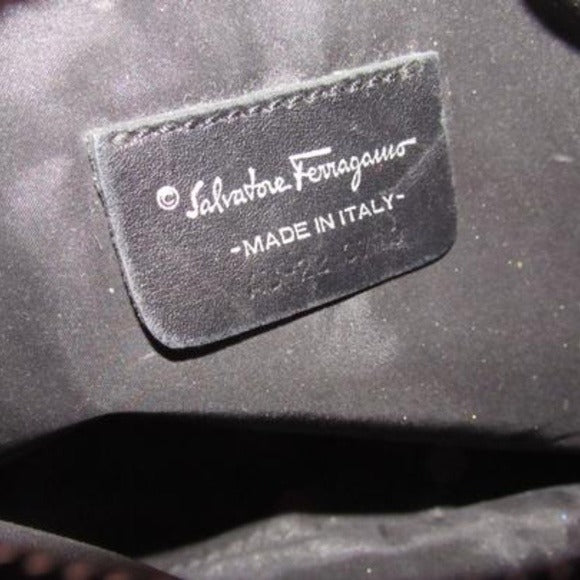 Vintage Salvatore Ferragamo black Gancini print fabric and black leather, cosmetic bag with a black wrist strap