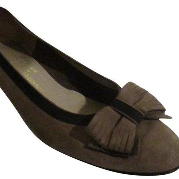 Salvatore Ferragamo VARA brown suede flats with black trim, large, fringe bows at the toes, and low, wedge heels