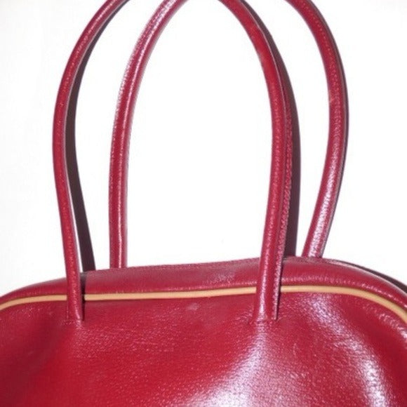 Vintage Furla deep red leather satchel style purse with tan piping, two handles, & two front pockets