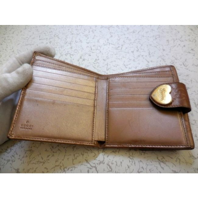 Gucci Camel Leather With An Embossed Large G Print And A Gold Heart Shaped Accent Design Wallet