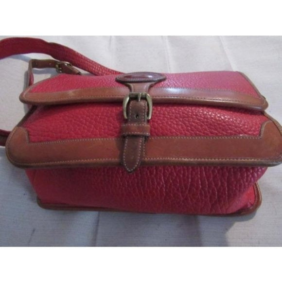 Vintage, Dooney and Bourke AWL, textured red leather and smooth camel leather, envelope top, cross body or shoulder bag with a removable adjustable strap, exterior pockets, brass accents