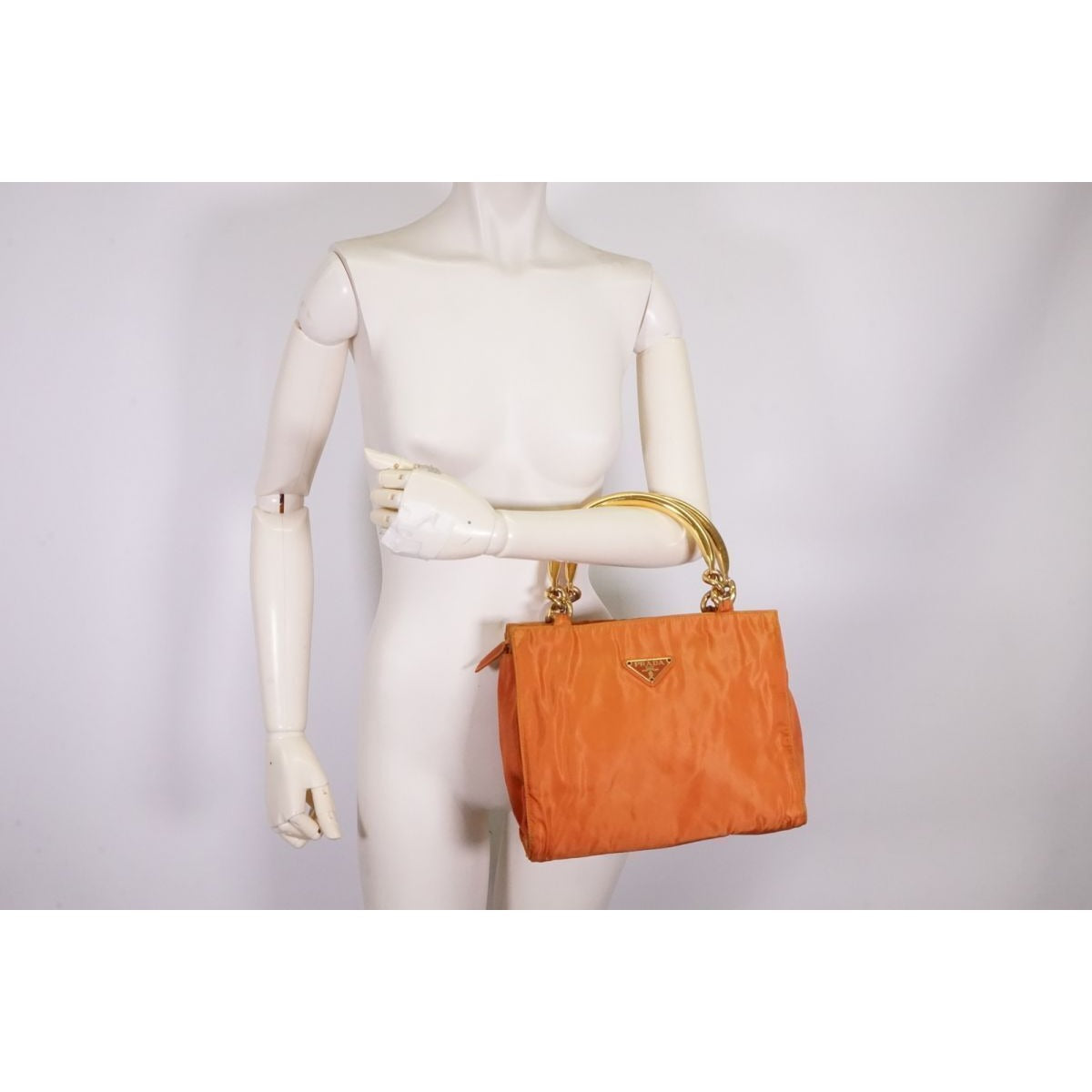 Prada orange re-edition 2000 satchel with gold metal handles