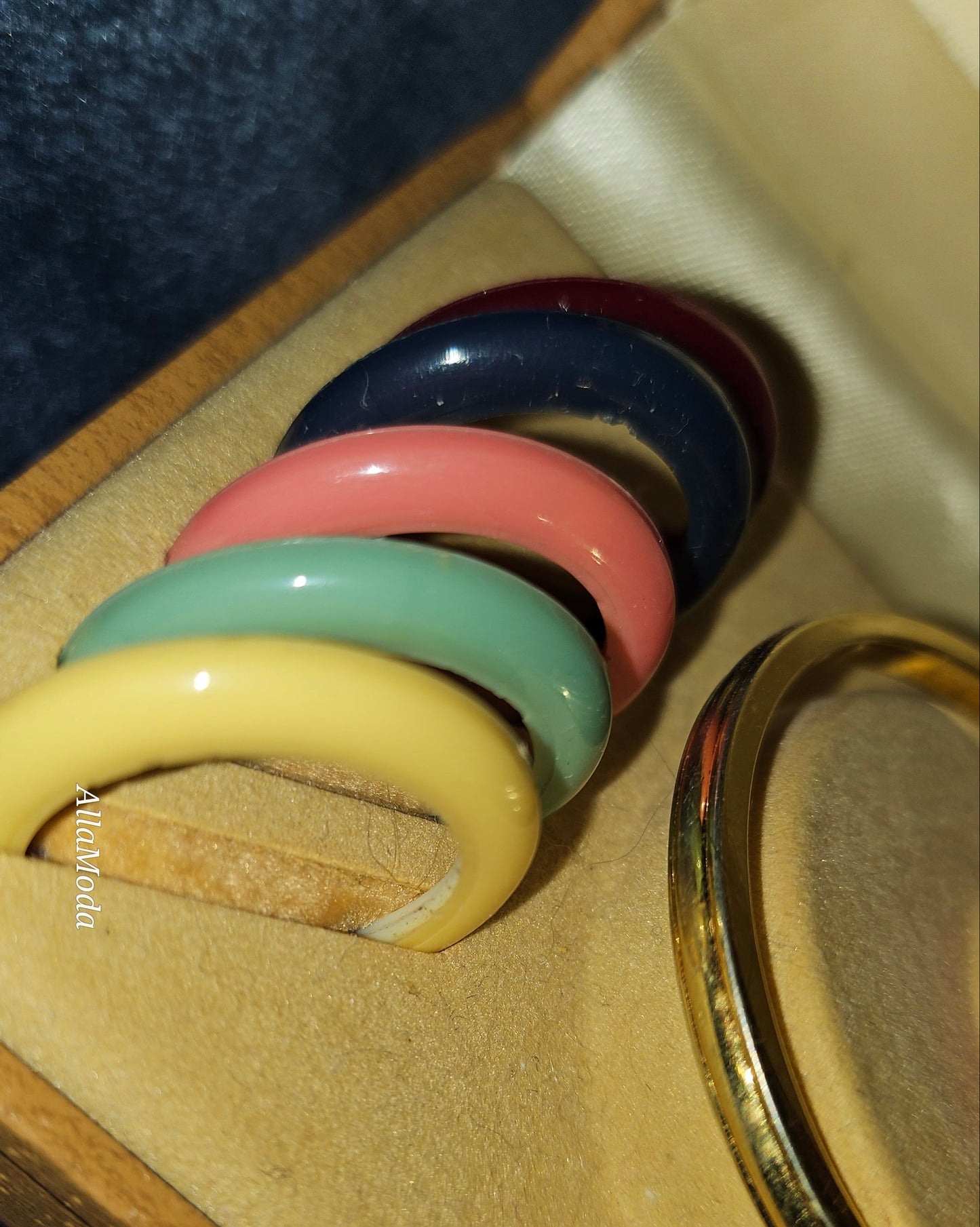 Gucci 1100- I, yellow gold, bangle style watch with twelve different colored, hard plastic resin bands