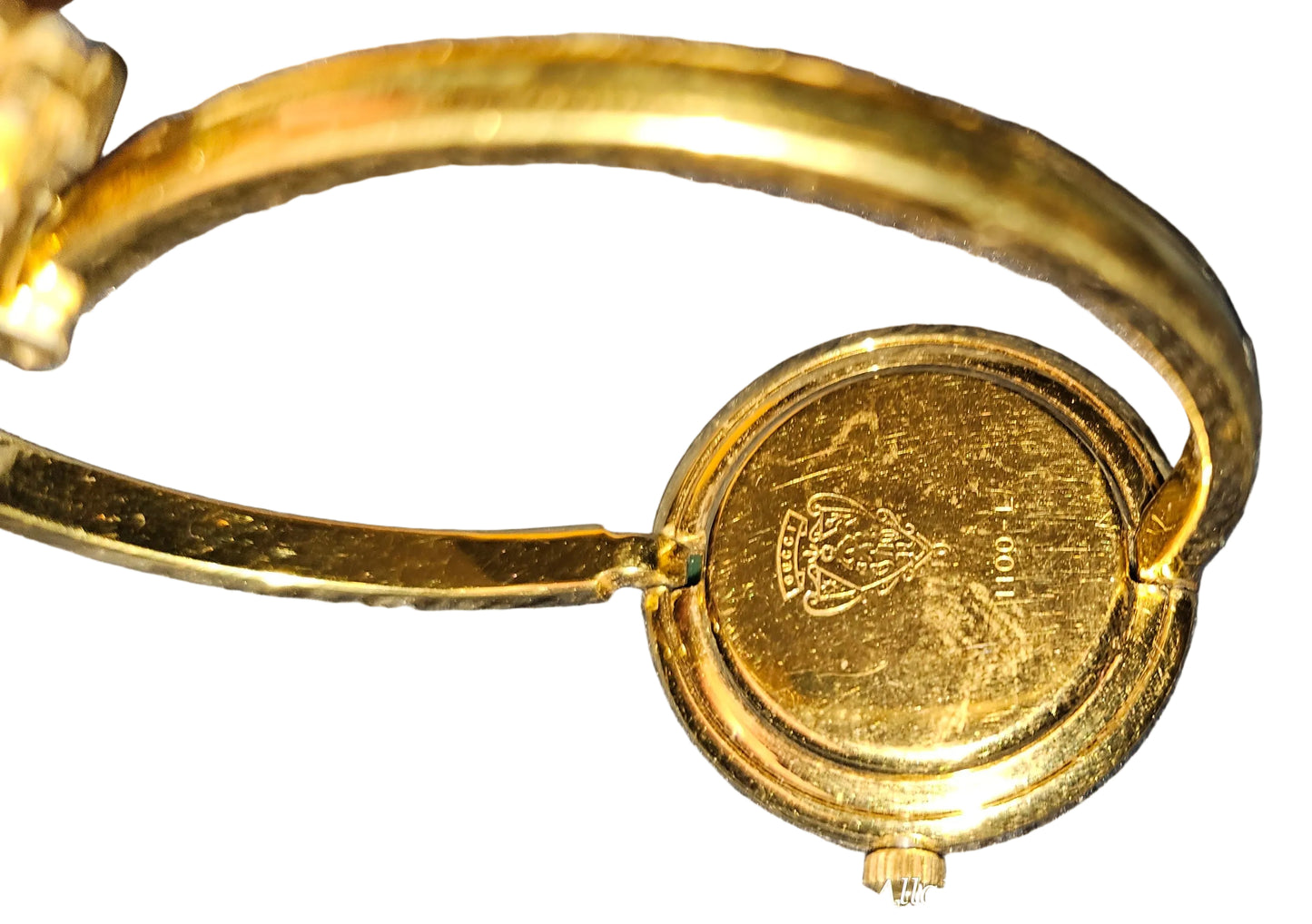 Gucci 1100- I, yellow gold, bangle style watch with twelve different colored, hard plastic resin bands