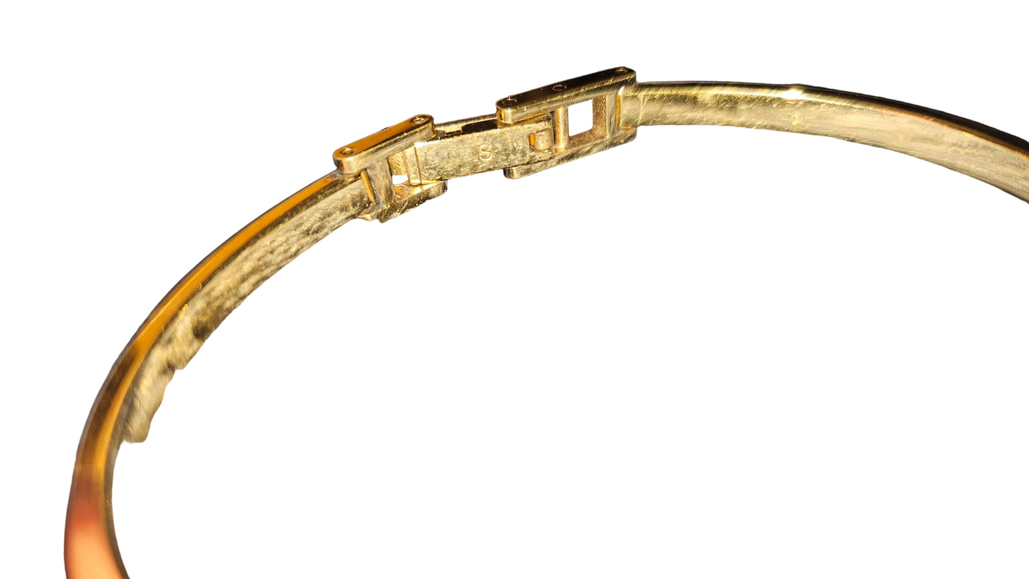 Gucci 1100- I, yellow gold, bangle style watch with twelve different colored, hard plastic resin bands