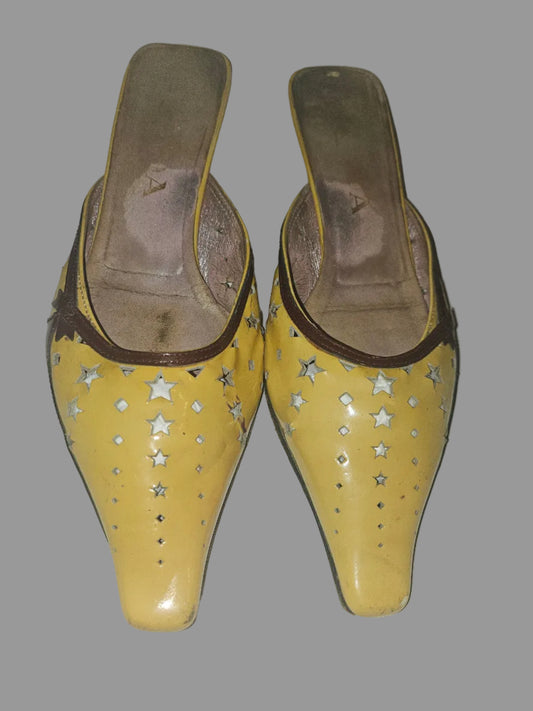 Prada kitten heel mules in yellow, brown, & dark red with star cut outs