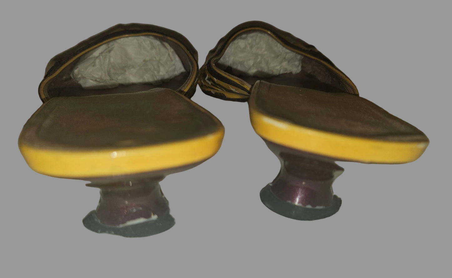 Prada kitten heel mules in yellow, brown, & dark red with star cut outs