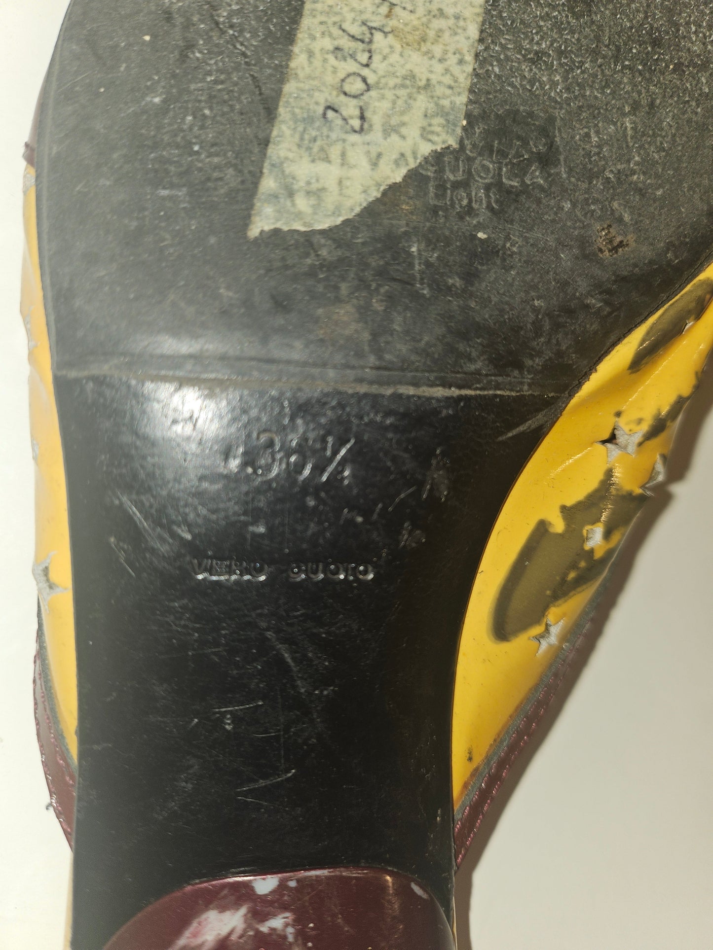 Prada kitten heel mules in yellow, brown, & dark red with star cut outs