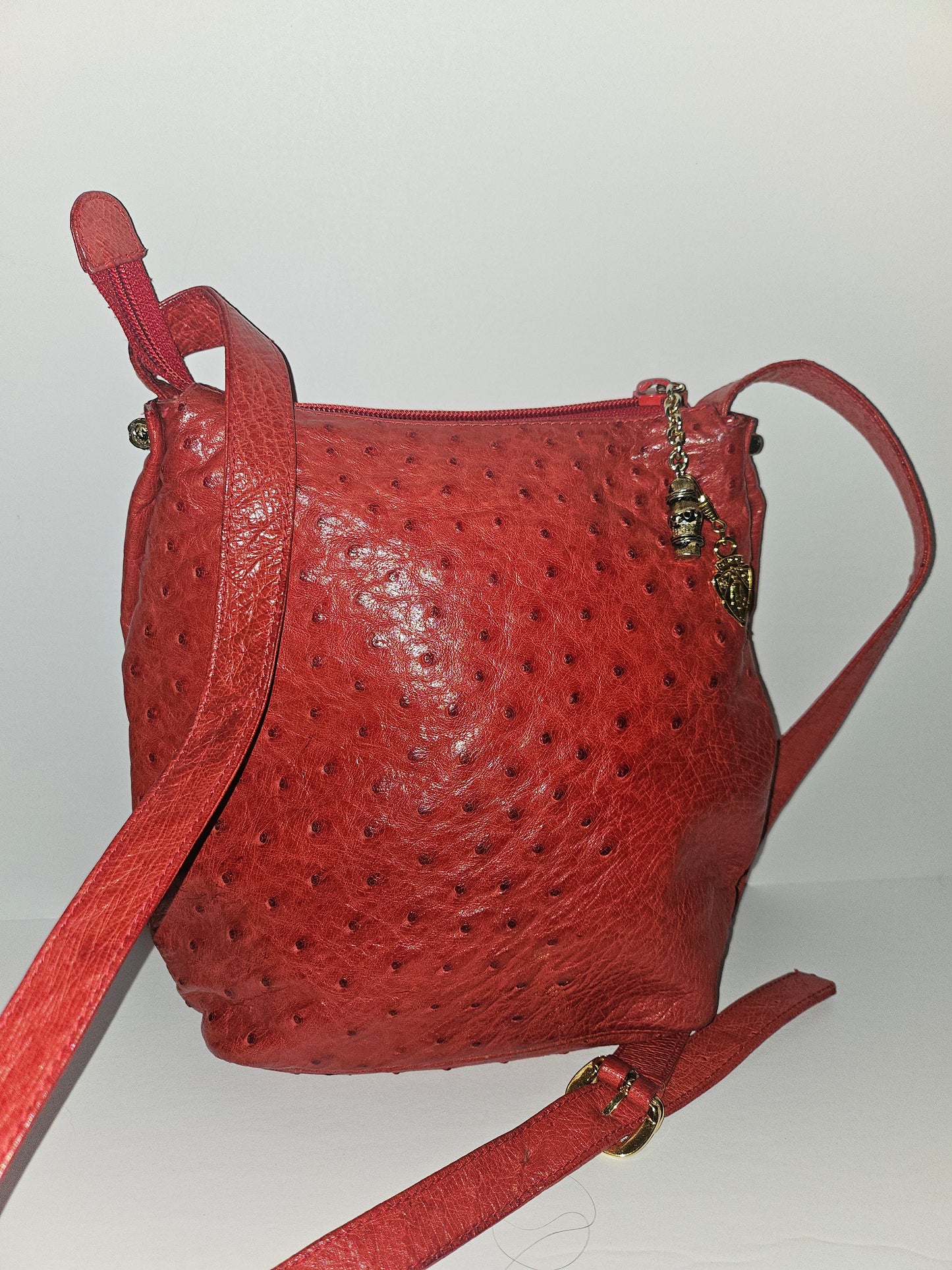 Gucci red ostrich leather cross body bucket bag
