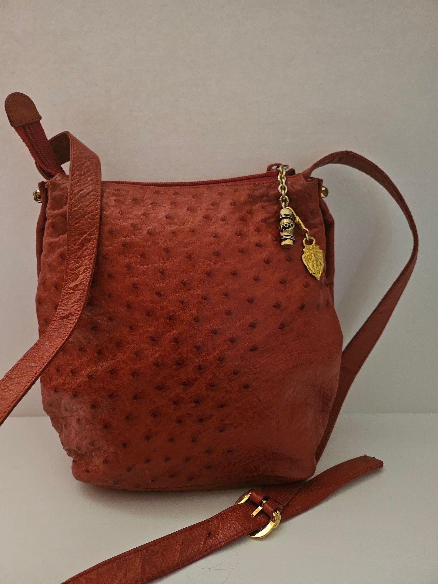 Gucci red ostrich leather cross body bucket bag